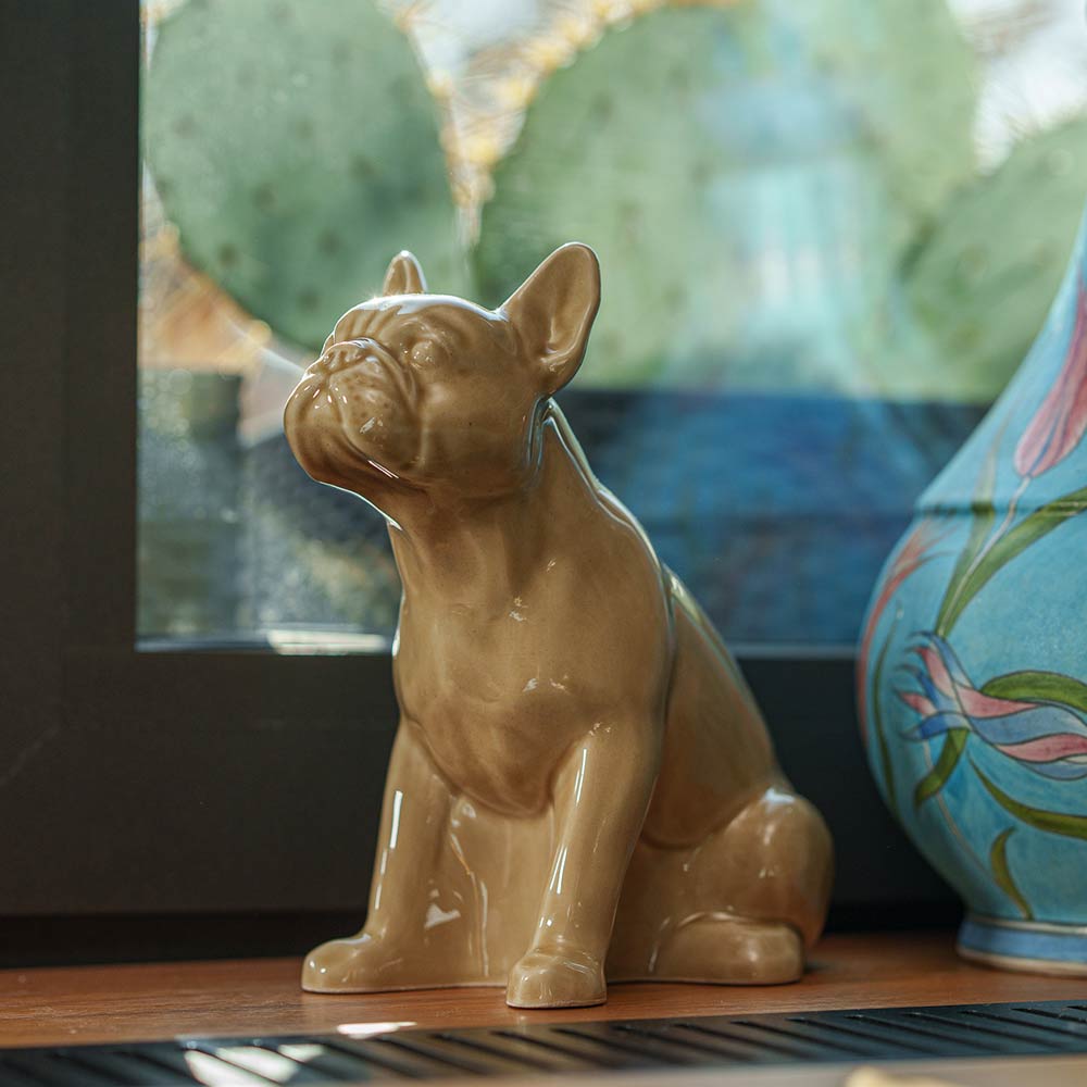 French Bulldog Pet Urn for Ashes in Beige on Shelf Facing Left