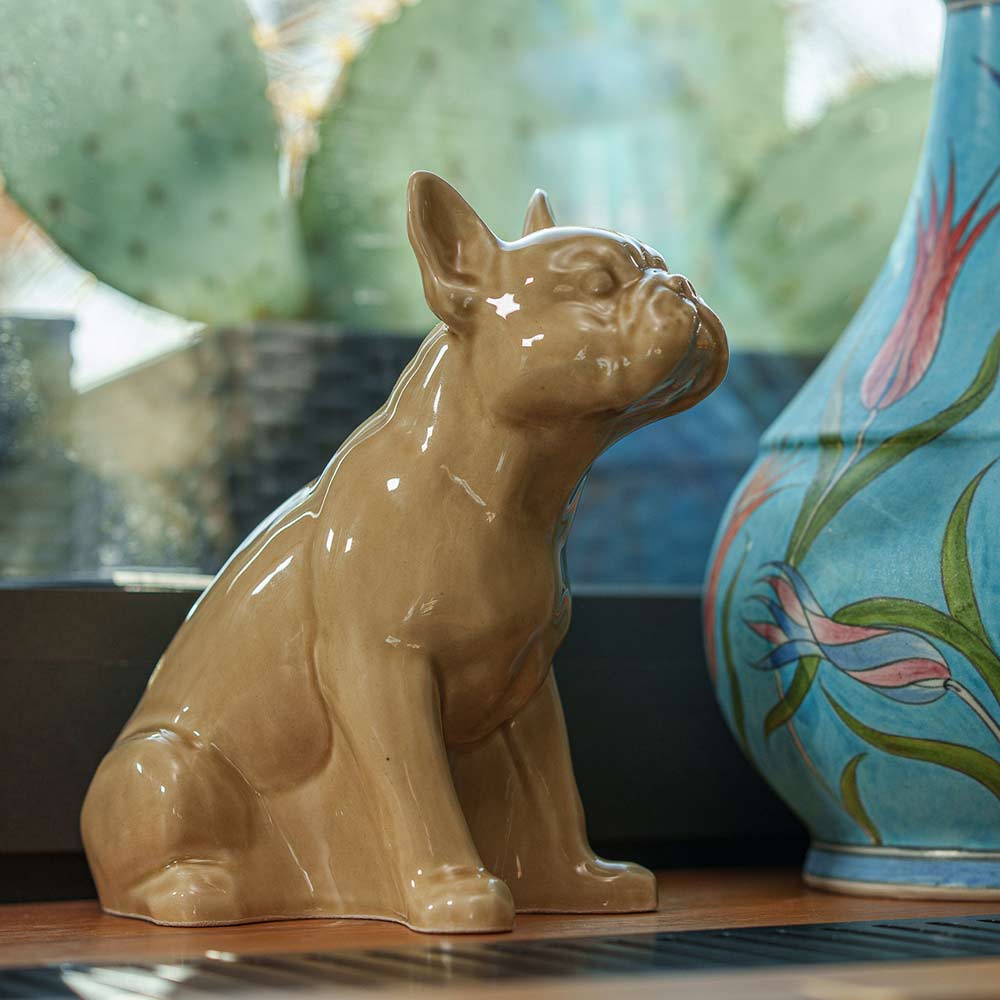 French Bulldog Pet Urn for Ashes in Beige on Shelf Facing Right