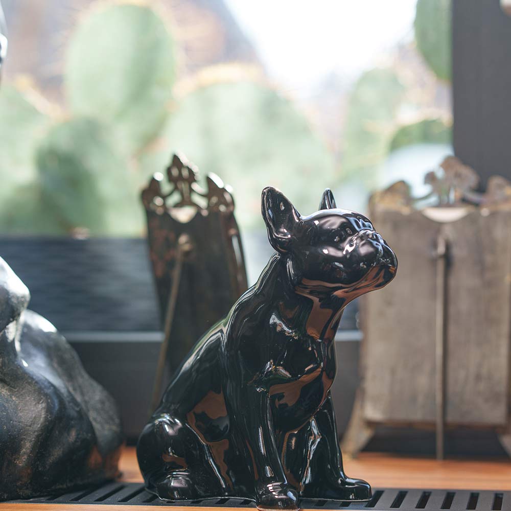 French Bulldog Pet Urn for Ashes in Glossy Black on Shelf Facing Right View