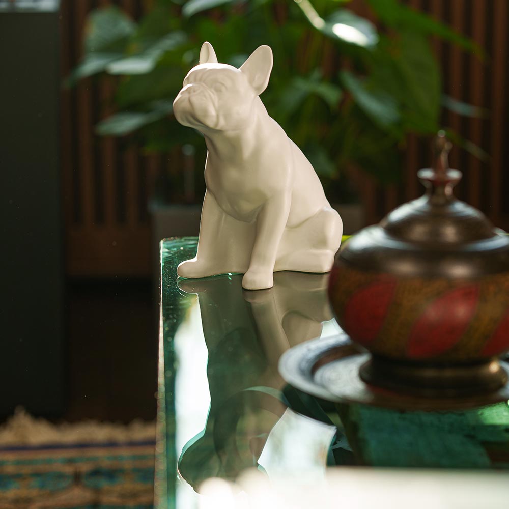 French Bulldog Pet Urn for Ashes in Matte White on Table Facing Left