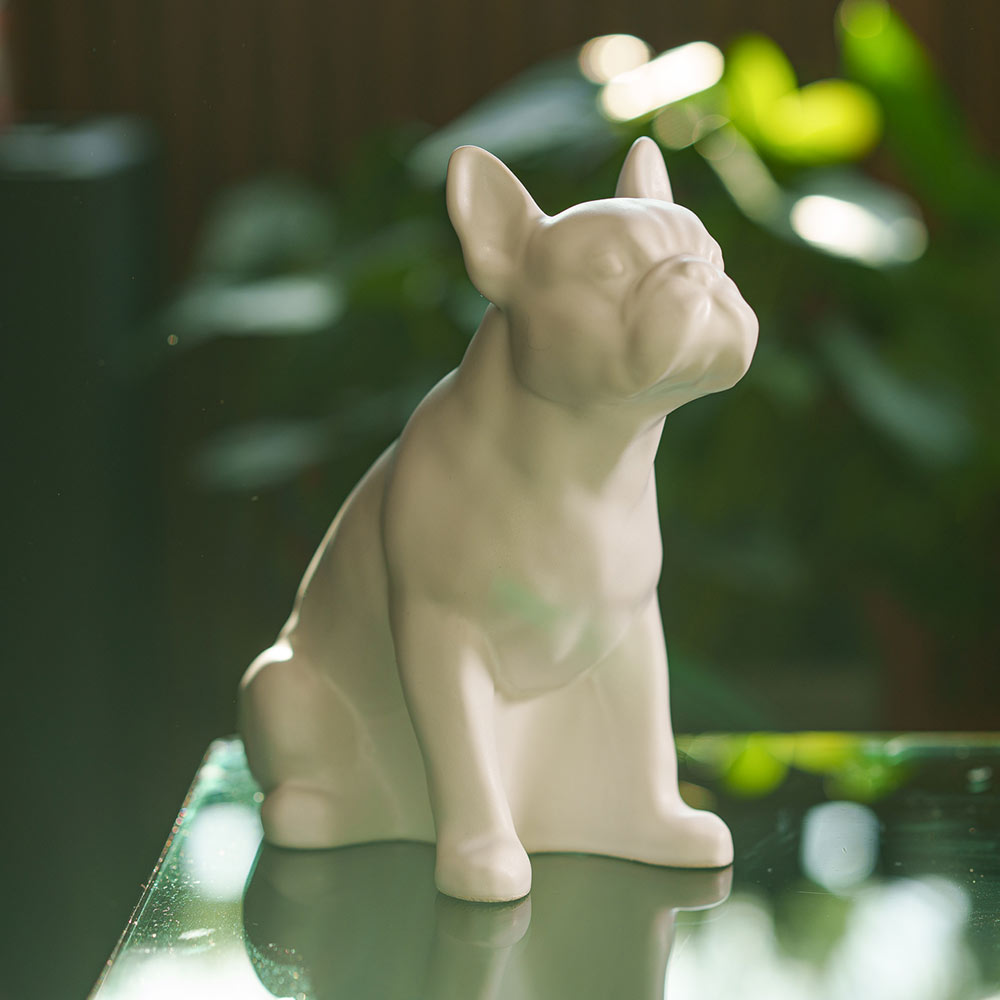 French Bulldog Pet Urn for Ashes in Matte White on Table Facing Right