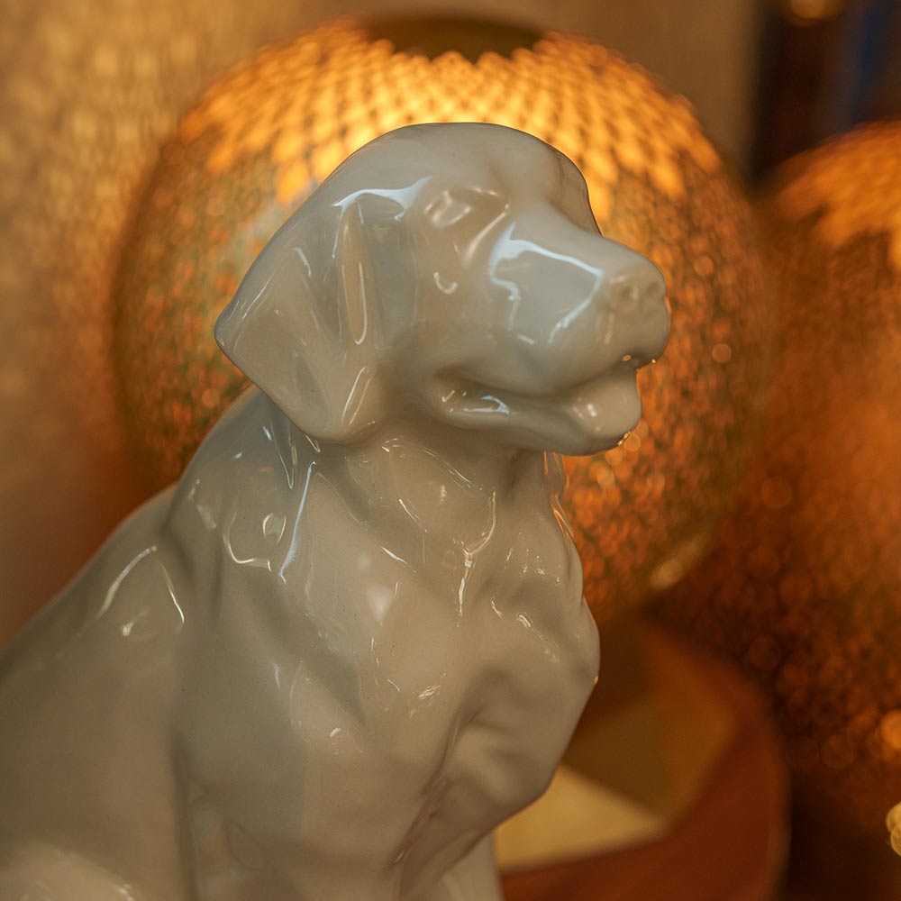 Golden Retriever Pet Urn for Ashes in Cream on Shelf Close Up