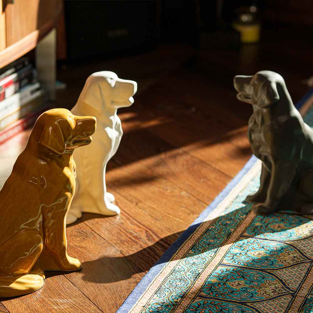 Golden Retriever Pet Urn for Ashes in Gold And Matte White and Matte Grey on Floor