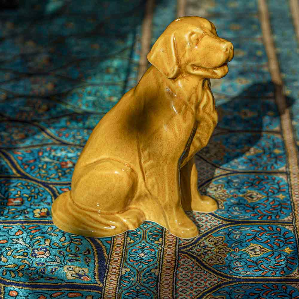 Golden Retriever Pet Urn for Ashes in Gold on Rug Right