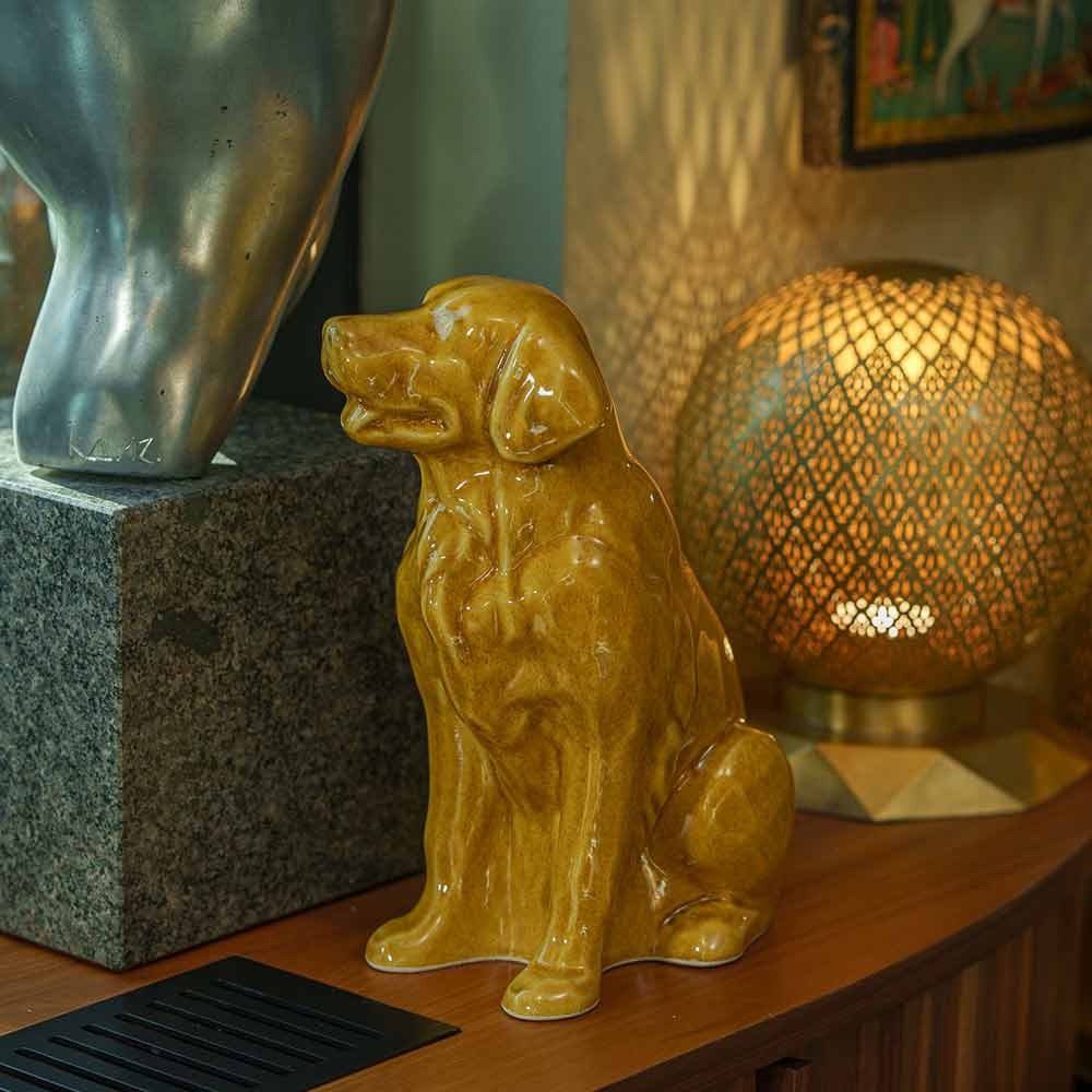 Golden Retriever Pet Urn for Ashes in Gold on Shelf Left View