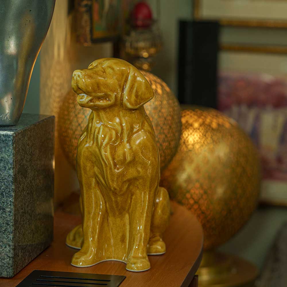 Golden Retriever Pet Urn for Ashes in Gold on Shelf Left