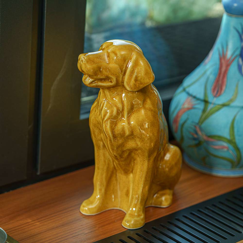 Golden Retriever Pet Urn for Ashes in Gold on Shelf Looking Left