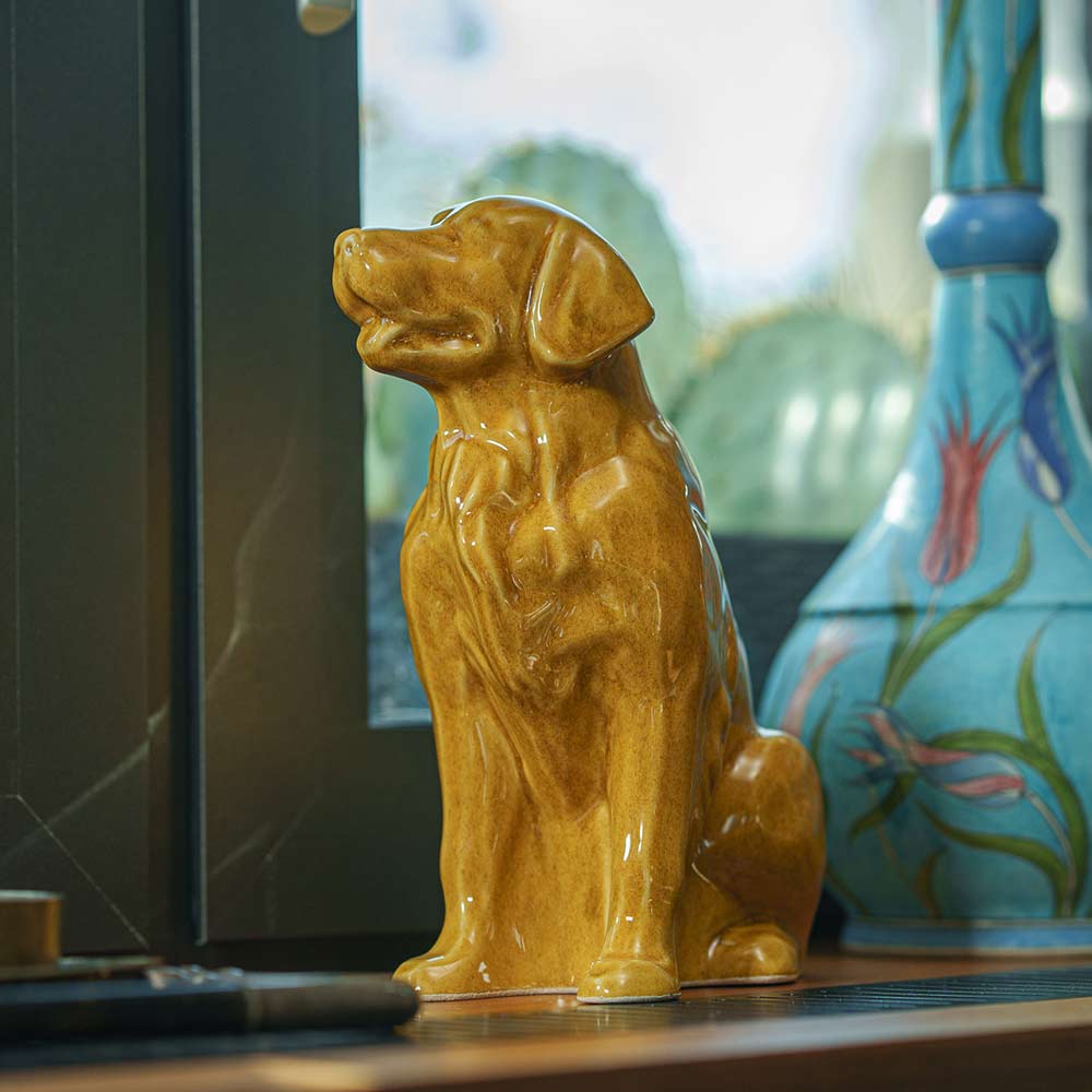 Golden Retriever Pet Urn for Ashes in Gold on Shelf Low Angle