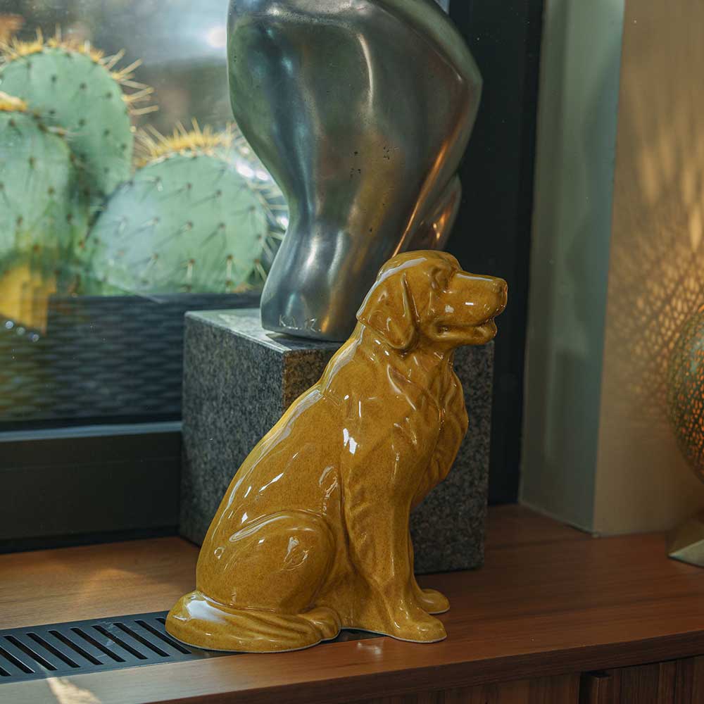 Golden Retriever Pet Urn for Ashes in Gold on Shelf Right View