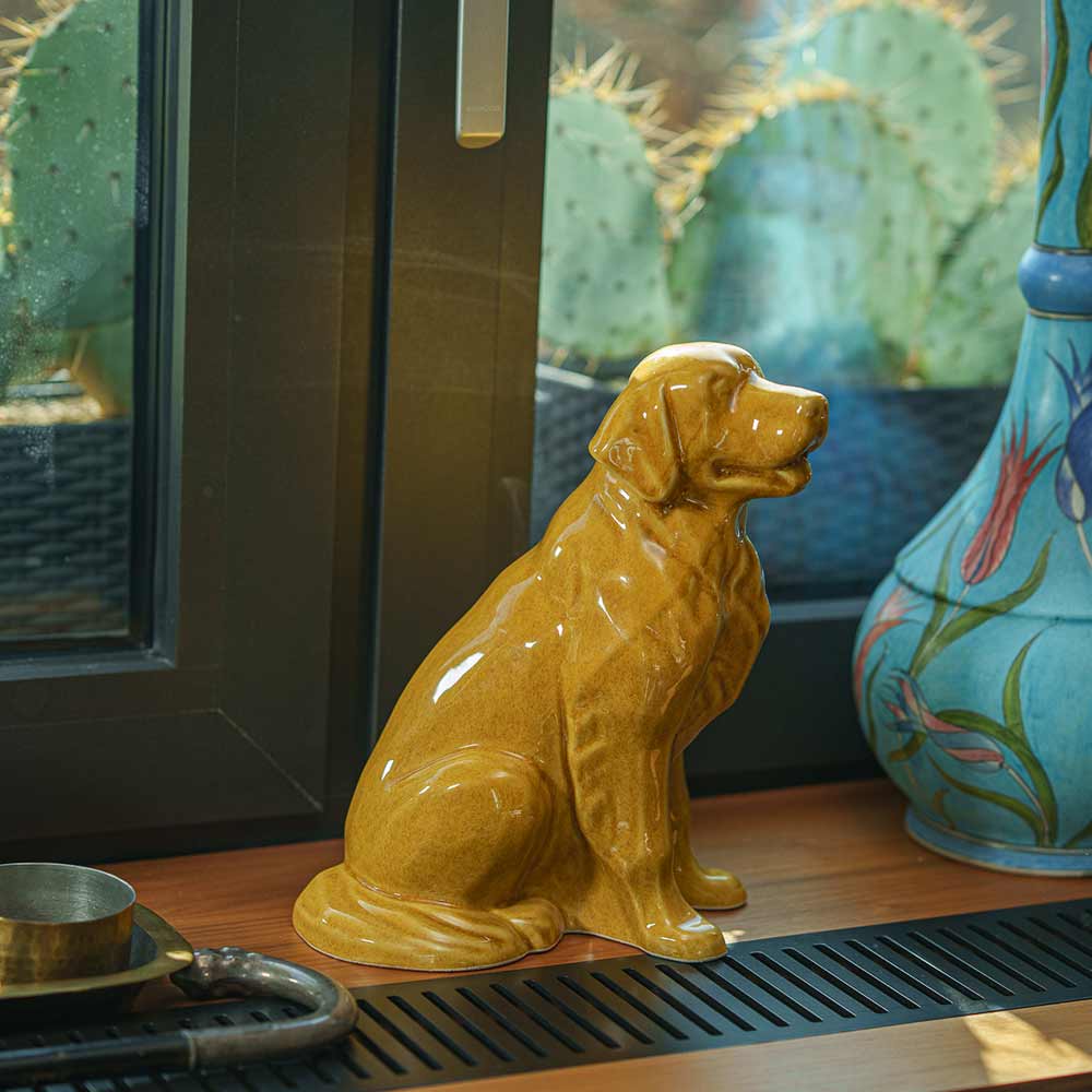 Golden Retriever Pet Urn for Ashes in Gold on Shelf