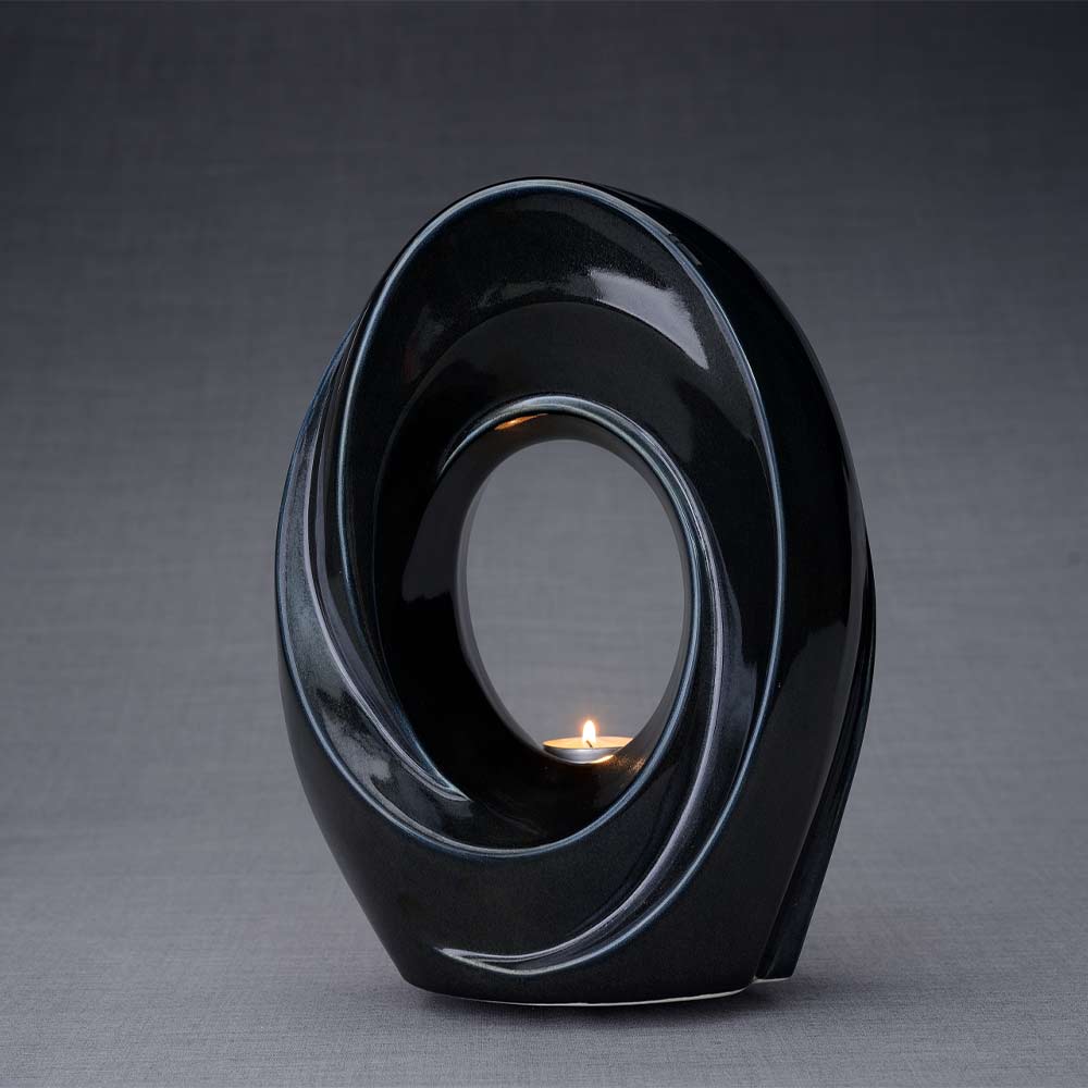The Passage Cremation Urn for Ashes in Midnight Blue Turned Left Dark Background